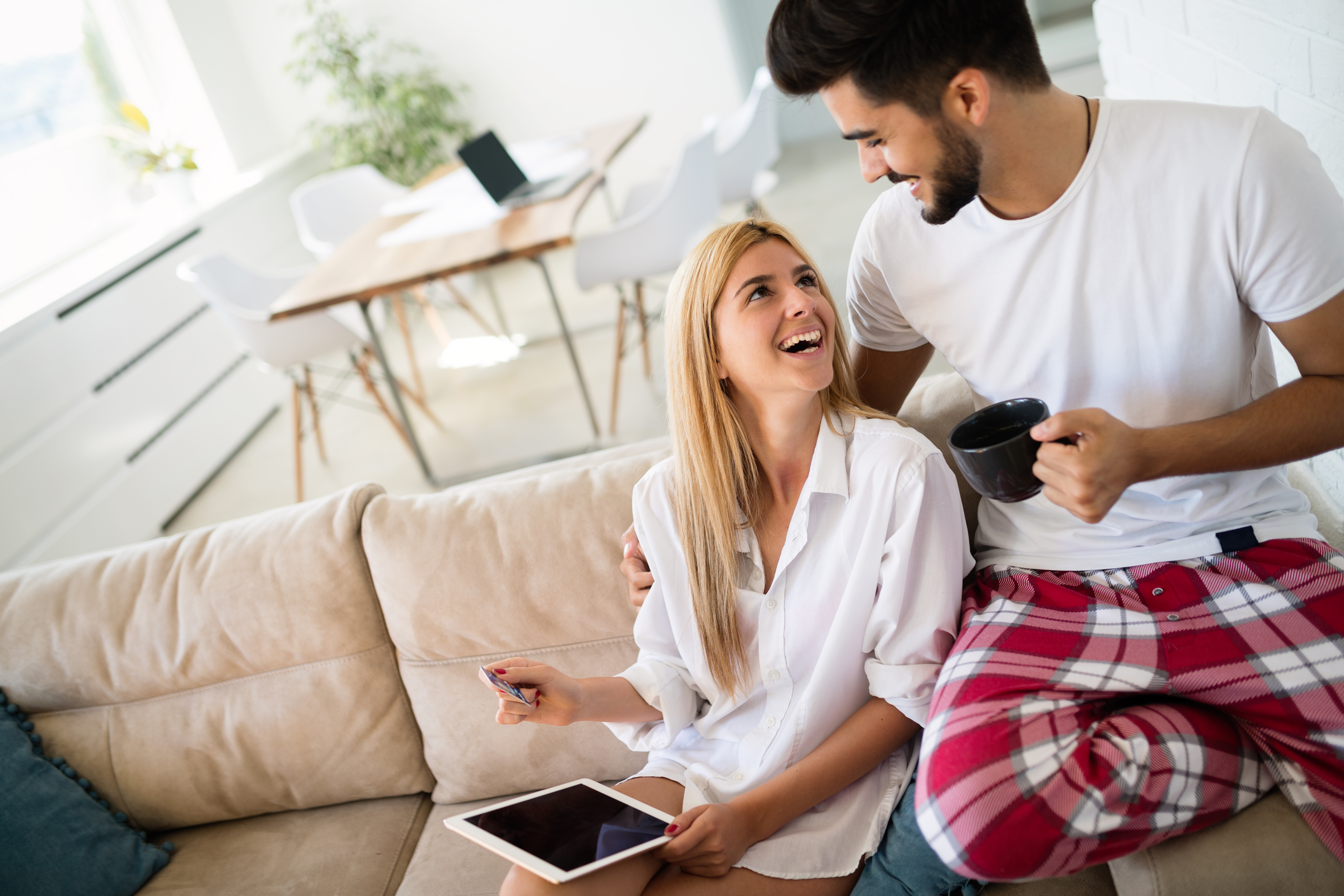 Couple shopping online using tablet